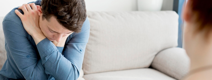 A gay person attending a one-on-one substance abuse therapy session for Adderall addiction