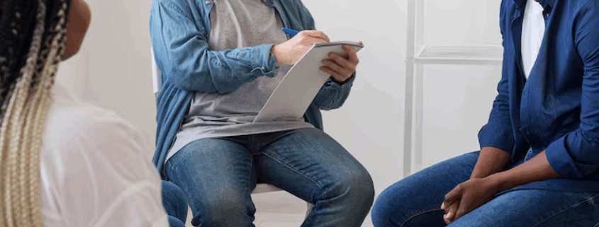 A group therapy among LGBTQ persons and a male therapist.
