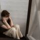 A young lesbian having a panic attacks while on the floor.