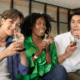 A group of LGBTQ individuals enjoying their sips of soda in a sober living home.