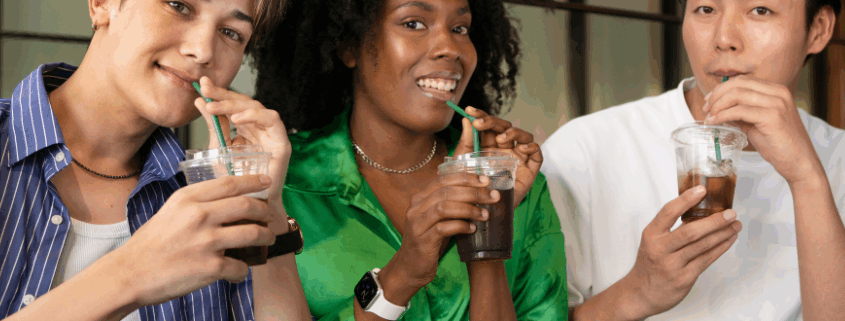 A group of LGBTQ individuals enjoying their sips of soda in a sober living home.